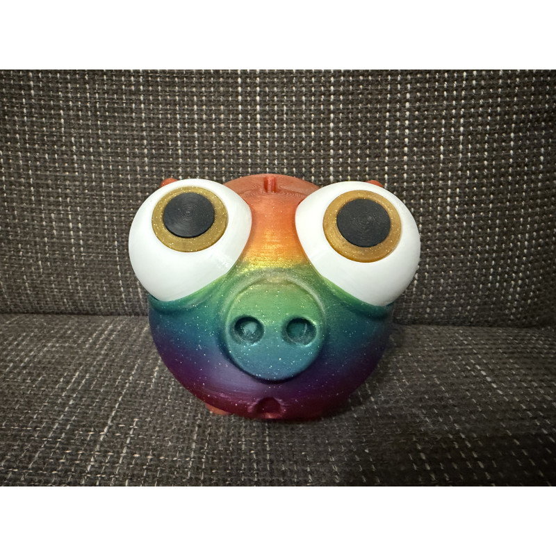 Farbiges Sparschwein mit großen Augen und Drehverschluss unten