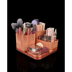 Modularer Kosmetik-Organizer in Roségold-Optik mit mehreren herausnehmbaren Einsätzen und Fächern für Make-up und Pinsel.